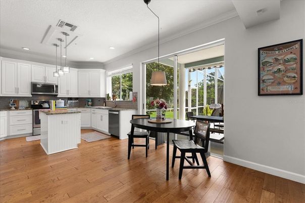 Dining room, Interior, Kitchen, Pendant Lights, Recessed Lighting, Stainless Steel Appliances, Wood Texture Flooring