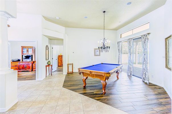 Billiard Table, Chandelier, Game Room, Interior, Pendant Lights, Recessed Lighting, Wood Texture Flooring