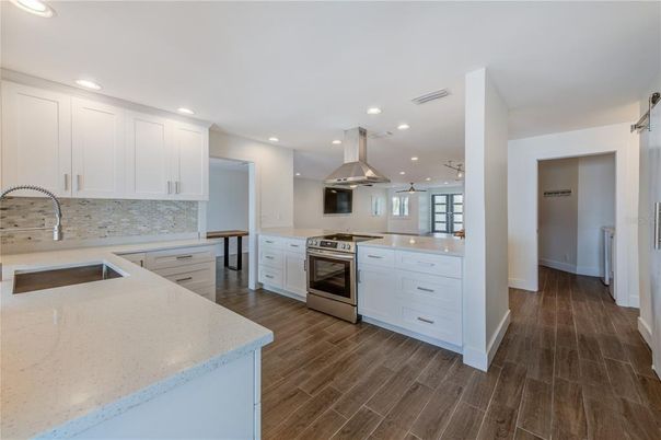 Interior, Kitchen, Pendant Lights, Recessed Lighting, Stainless Steel Appliances, Wood Texture Flooring