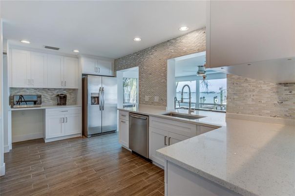 Interior, Kitchen, Recessed Lighting, Stainless Steel Appliances, Stone Walls, Wood Texture Flooring