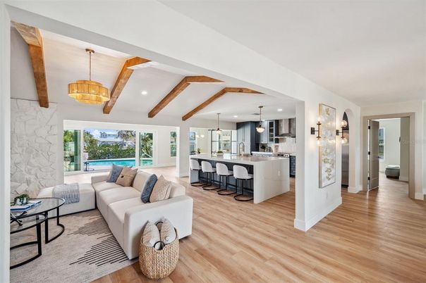 Interior, Kitchen, Living room, Pendant Lights, Recessed Lighting, Stainless Steel Appliances, Stone Walls, Wooden Beams, Wood Texture Flooring