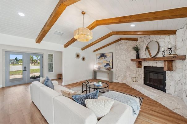 Fireplace, Interior, Living room, Pendant Lights, Recessed Lighting, Stone Walls, Wooden Beams, Wood Texture Flooring