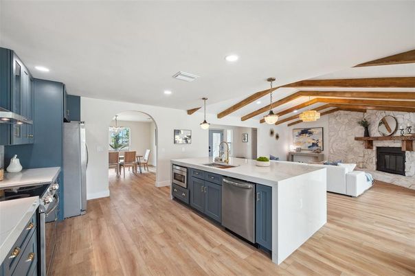 Dining room, Fireplace, Interior, Kitchen, Living room, Pendant Lights, Recessed Lighting, Stainless Steel Appliances, Stone Walls, Wooden Beams, Wood Texture Flooring