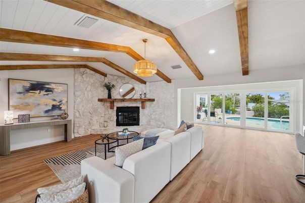 Fireplace, Interior, Living room, Pendant Lights, Recessed Lighting, Stone Walls, Wooden Beams, Wood Texture Flooring