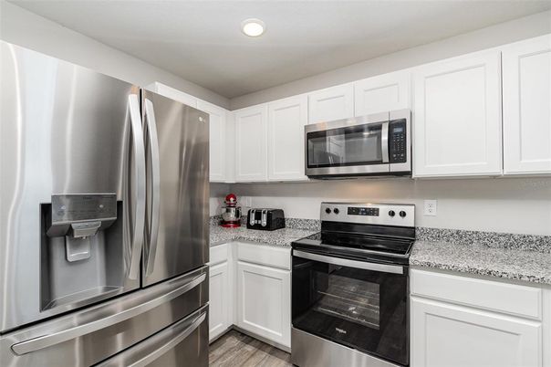 Interior, Kitchen, Recessed Lighting, Stainless Steel Appliances, Wood Texture Flooring