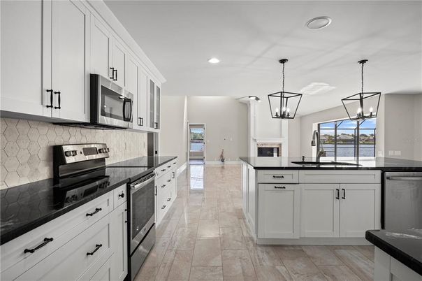 Fireplace, Interior, Kitchen, Pendant Lights, Recessed Lighting, Stainless Steel Appliances
