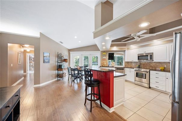 Dining room, Interior, Kitchen, Recessed Lighting, Stainless Steel Appliances, Wood Texture Flooring