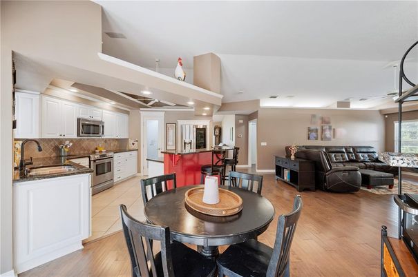 Dining room, Interior, Kitchen, Living room, Recessed Lighting, Stainless Steel Appliances, Wood Texture Flooring