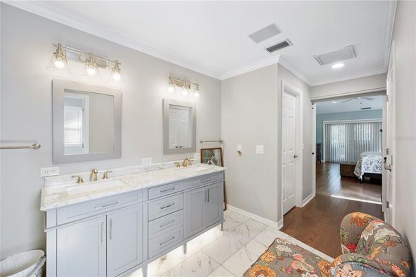 Bathroom, Dual Sink Vanities, Interior, Marble, Recessed Lighting, Wood Texture Flooring