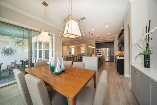 Dining room, Interior, Kitchen, Pendant Lights, Recessed Lighting, Stainless Steel Appliances, Wood Texture Flooring