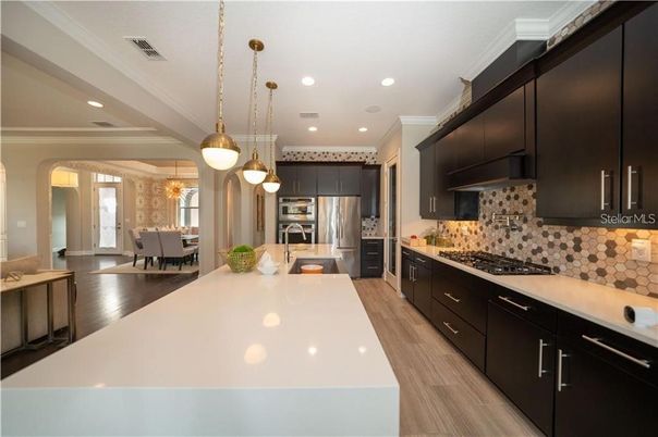 Dining room, Interior, Kitchen, Pendant Lights, Recessed Lighting, Stainless Steel Appliances, Wood Texture Flooring