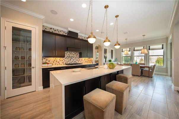 Dining room, Interior, Kitchen, Pendant Lights, Recessed Lighting, Stainless Steel Appliances, Wood Texture Flooring