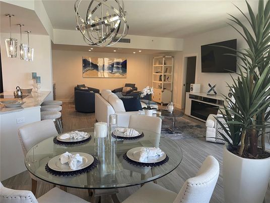 Chandelier, Dining room, Fireplace, Interior, Living room, Pendant Lights, Recessed Lighting, Wood Texture Flooring
