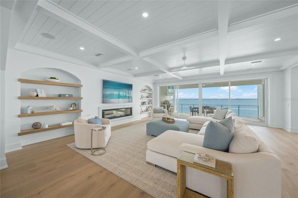 Fireplace, Interior, Living room, Recessed Lighting, Water, Wood Texture Flooring