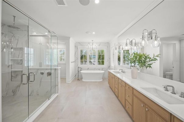 Bathroom, Dual Sink Vanities, Free Standing Baths, Glass Shower, Interior, Marble Walls, Recessed Lighting
