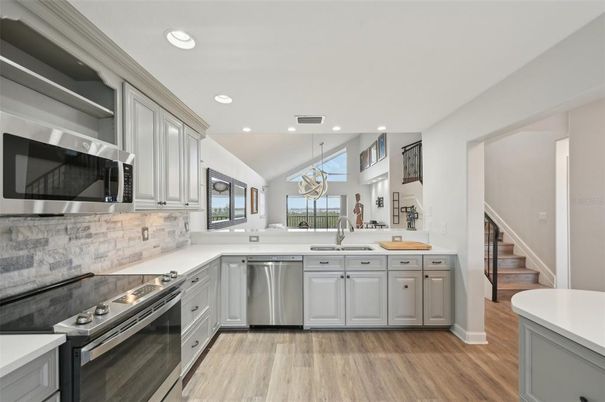 Interior, Kitchen, Pendant Lights, Recessed Lighting, Stainless Steel Appliances, Wood Texture Flooring