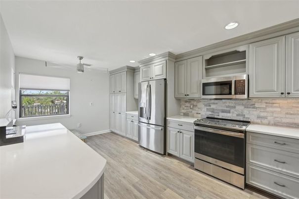 Interior, Kitchen, Recessed Lighting, Stainless Steel Appliances, Wood Texture Flooring