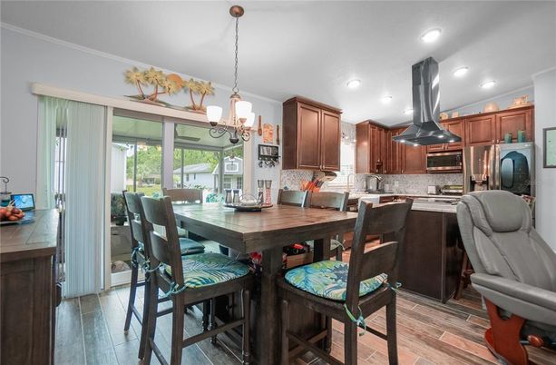 Dining room, Interior, Kitchen, Pendant Lights, Recessed Lighting, Stainless Steel Appliances, Wood Texture Flooring