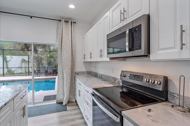 Interior, Kitchen, Recessed Lighting, Stainless Steel Appliances, Wood Texture Flooring