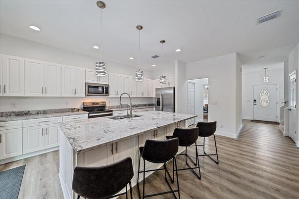 Interior, Kitchen, Pendant Lights, Recessed Lighting, Stainless Steel Appliances, Wood Texture Flooring