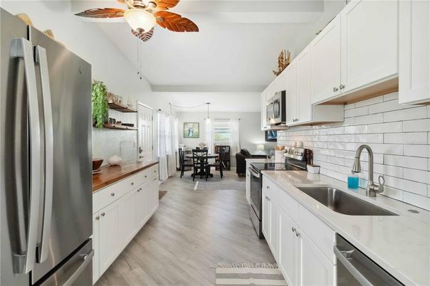 Dining room, Interior, Kitchen, Pendant Lights, Stainless Steel Appliances, Wood Texture Flooring