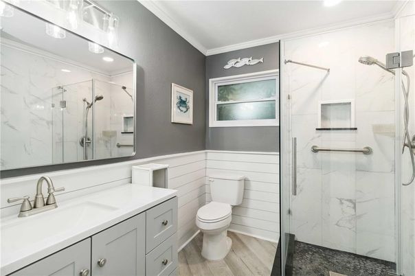 Bathroom, Glass Shower, Interior, Marble Walls, Recessed Lighting, Wood Texture Flooring