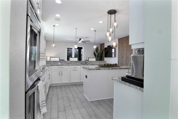 Interior, Kitchen, Pendant Lights, Recessed Lighting, Stainless Steel Appliances, Wood Texture Flooring