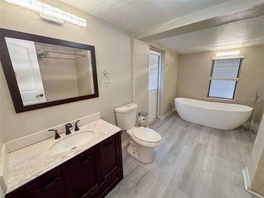 Bathroom, Dual Sink Vanities, Free Standing Baths, Interior, Wood Texture Flooring