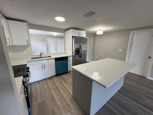 Interior, Kitchen, Recessed Lighting, Stainless Steel Appliances, Wood Texture Flooring