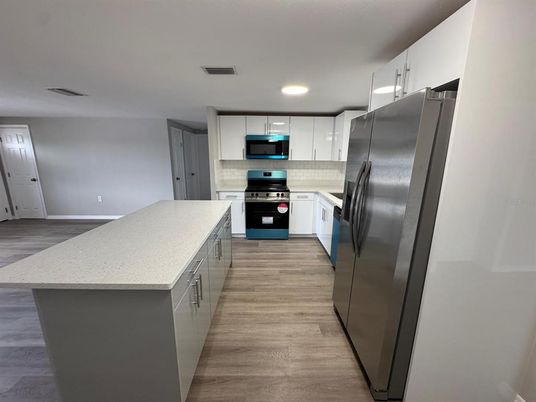 Interior, Kitchen, Recessed Lighting, Stainless Steel Appliances, Wood Texture Flooring