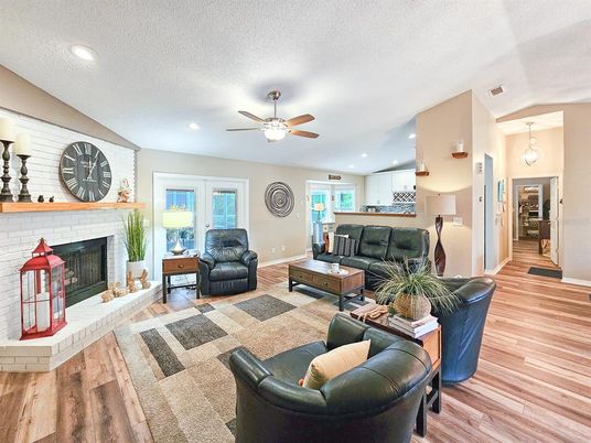 Fireplace, Interior, Living room, Pendant Lights, Recessed Lighting, Stone Walls, Wood Texture Flooring