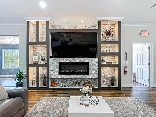 Fireplace, Interior, Living room, Recessed Lighting, Stone Walls, Wood Texture Flooring