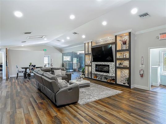 Dining room, Fireplace, Interior, Living room, Recessed Lighting, Wood Texture Flooring