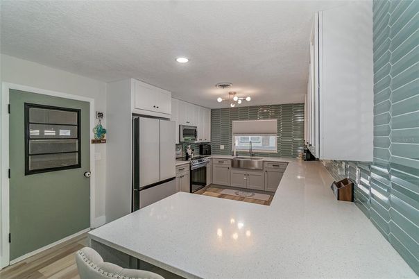 Interior, Kitchen, Recessed Lighting, Stainless Steel Appliances, Wood Texture Flooring