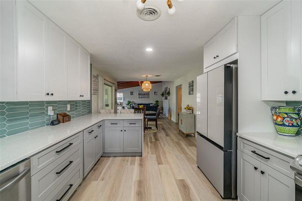Dining room, Interior, Kitchen, Recessed Lighting, Stainless Steel Appliances, Wood Texture Flooring