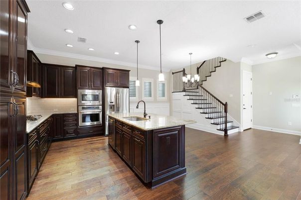 Chandelier, Interior, Kitchen, Pendant Lights, Recessed Lighting, Stainless Steel Appliances, Wood Texture Flooring