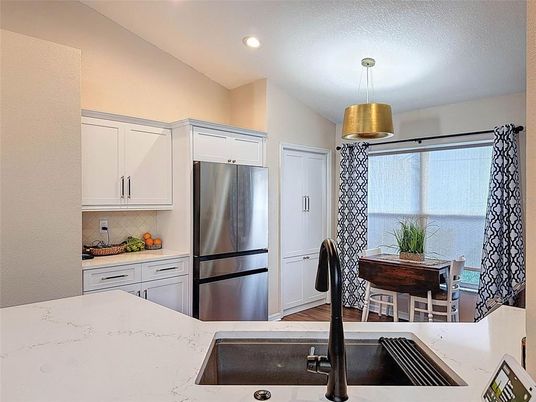 Dining room, Interior, Kitchen, Recessed Lighting, Stainless Steel Appliances, Wood Texture Flooring