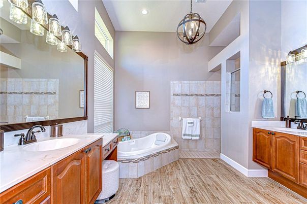 Bathroom, Dual Sink Vanities, Interior, Pendant Lights, Recessed Lighting, Wood Texture Flooring