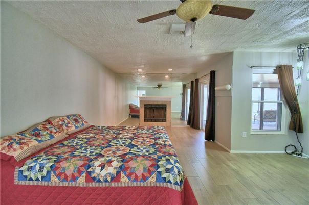 Bedroom, Fireplace, Interior, Recessed Lighting, Wood Texture Flooring