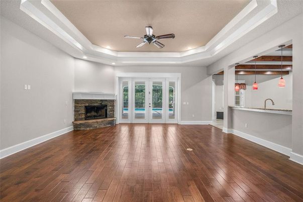 Empty room, Fireplace, Interior, Pendant Lights, Recessed Lighting, Wood Texture Flooring