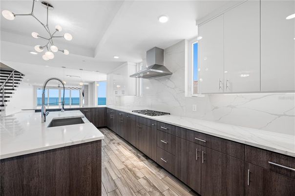 Interior, Kitchen, Marble Walls, Pendant Lights, Recessed Lighting, Wood Texture Flooring