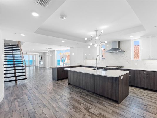 Interior, Kitchen, Marble Walls, Pendant Lights, Recessed Lighting, Stainless Steel Appliances, Wood Texture Flooring