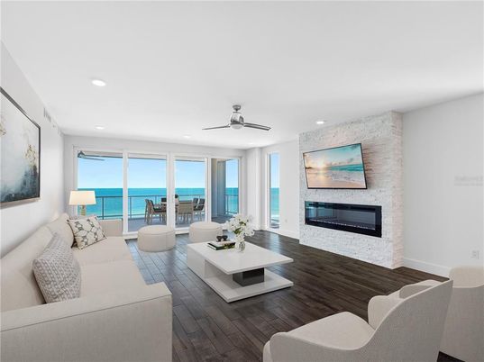 Fireplace, Interior, Living room, Recessed Lighting, Stone Walls, Water, Wood Texture Flooring