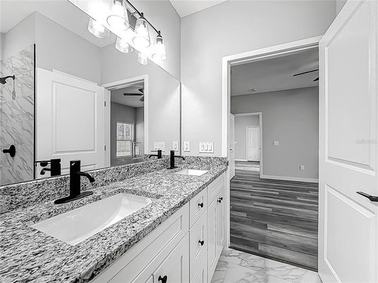 Bathroom, Dual Sink Vanities, Interior, Marble, Marble Walls, Wood Texture Flooring