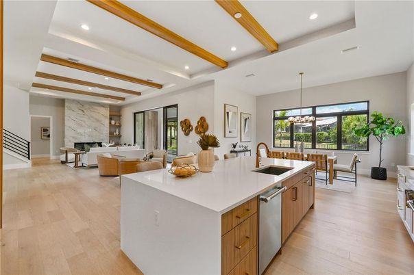 Dining room, Fireplace, Interior, Kitchen, Living room, Pendant Lights, Recessed Lighting, Stainless Steel Appliances, Wooden Beams, Wood Texture Flooring