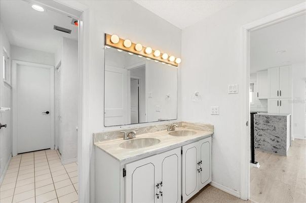 Bathroom, Dual Sink Vanities, Interior, Recessed Lighting, Wood Texture Flooring