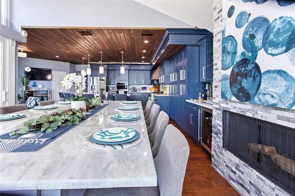Dining room, Fireplace, Interior, Kitchen, Pendant Lights, Recessed Lighting, Stainless Steel Appliances, Wooden Ceilings, Wood Texture Flooring