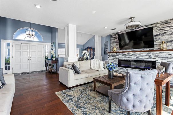 Fireplace, Interior, Living room, Pendant Lights, Recessed Lighting, Stone Walls, Wood Texture Flooring