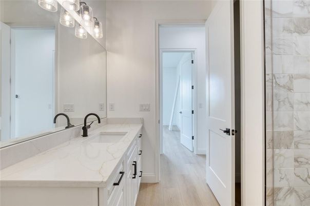 Bathroom, Dual Sink Vanities, Interior, Marble Walls, Wood Texture Flooring