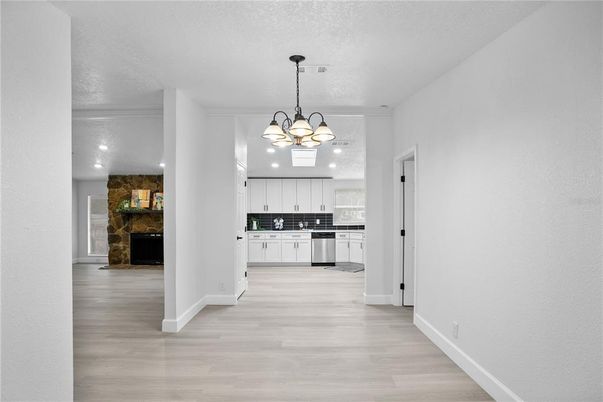 Chandelier, Interior, Kitchen, Pendant Lights, Recessed Lighting, Stone Walls, Wood Texture Flooring